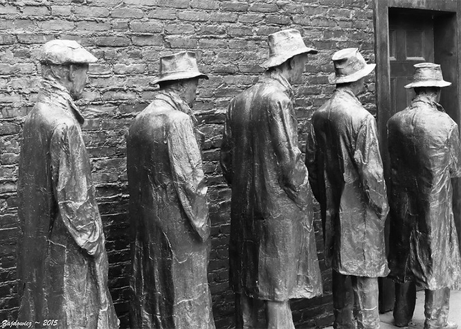 Lifesize sculpture of 5 men queing for bread in the Depression era